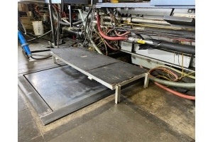 Manufacturer's working platforms before Wearwell's Foundation platforms were installed