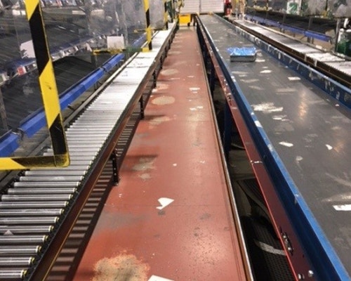 Damaged rubber floor matting of a meal prep company before Wearwell's Diamond-Plate installation