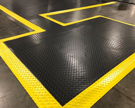 Man falling from a slippery mat before using Wearwell's customizable safe matting