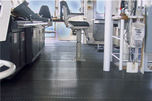 Wearwell's Diamond-Plate Switchboard Mat installed to protect workers from electric shock